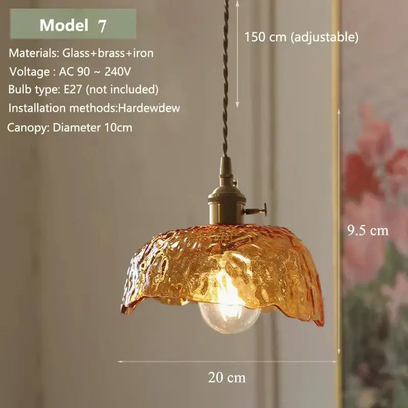 Vintage amber glass pendant light with textured hand-blown finish and brass hardware for kitchen island lighting