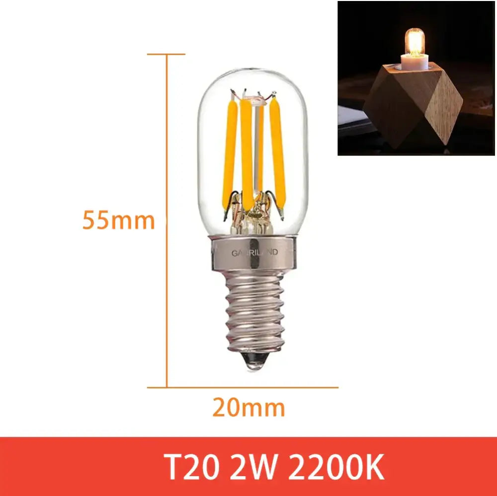 A clear glass vintage amber led bulb with three yellow filaments and silver base for home decor by decorbites dimmable led