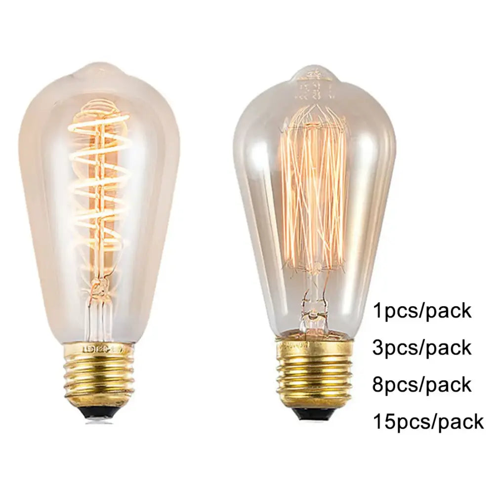 Two vintage-style edison light bulbs with clear glass, brass bases, and amber warm led spiral filaments for decorbites