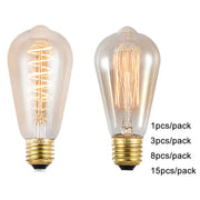 Two vintage-style edison light bulbs with clear glass, brass bases, and amber warm led spiral filaments for decorbites