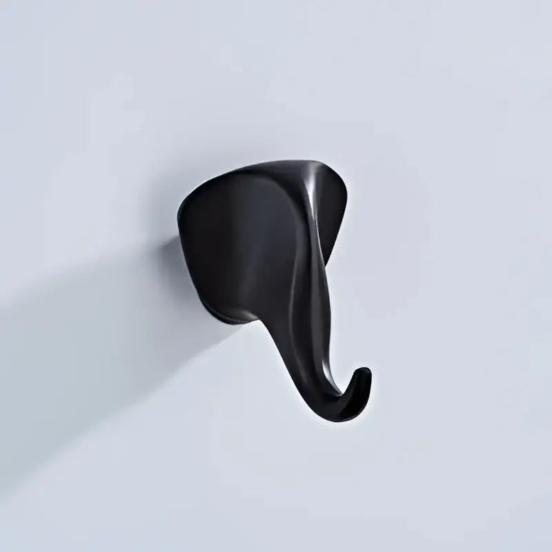 Black matte-finished vintage animal brass robe hook shaped like an elephant with sleek minimalist decorbites brass robe hooks design