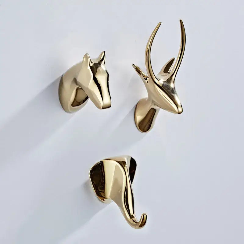 Gold-colored metallic vintage animal brass robe hooks featuring horse deer and elephant designs for bathroom decorbites brass robe hooks