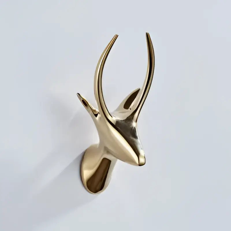 Gold-colored brass deer head wall decor with polished antlers and minimalist design vintage brass robe hooks for bathroom decorbites brass robe hooks
