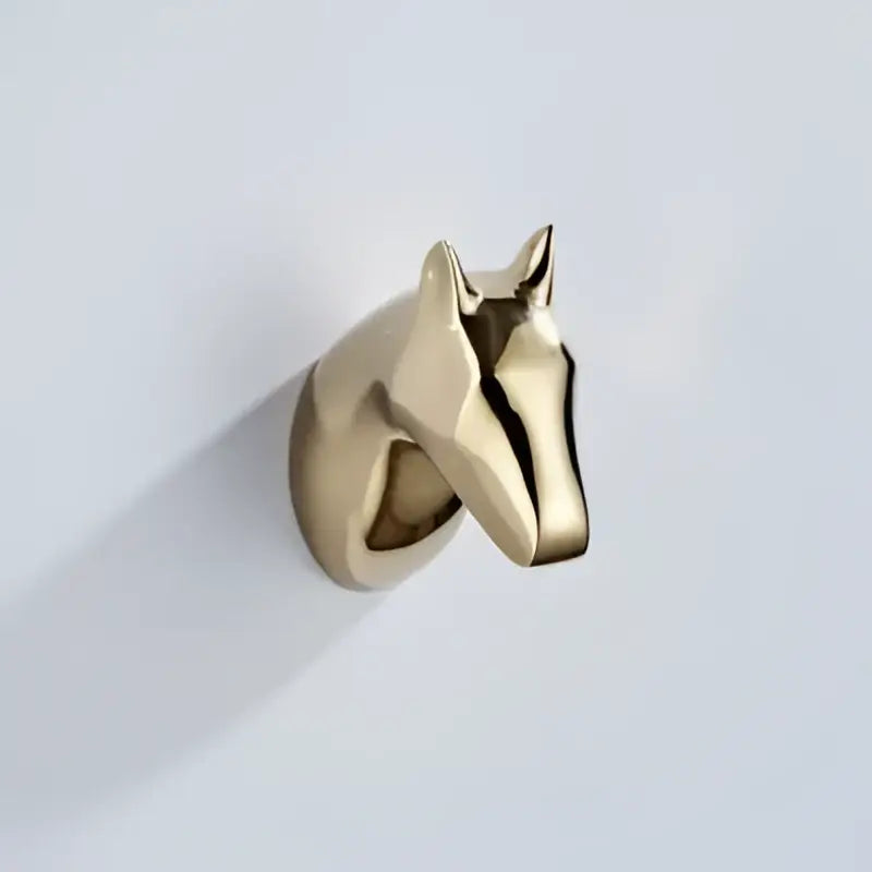 Gold-colored metallic horse head wall hook with sleek minimalist design for vintage brass robe hooks decorbites decorbites brass robe