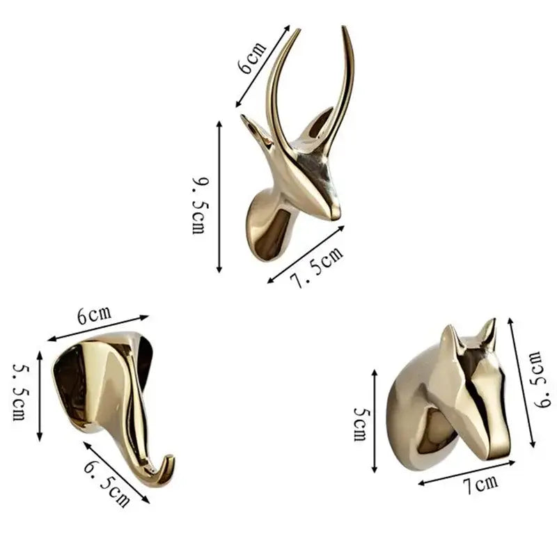 Gold-colored decorbites brass robe hooks shaped as deer elephant and horse heads for vintage bathroom decor