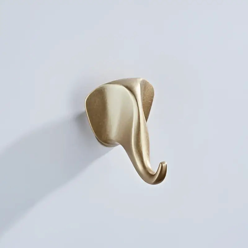 Gold-colored vintage animal brass robe hook with smooth polished metallic finish for bathroom wall decorbites brass robe hooks