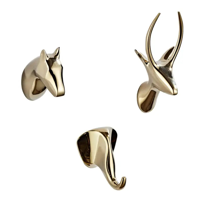 Gold-toned vintage animal brass robe hooks shaped like horse head antlers and elephant trunk for bathroom decorbites decor