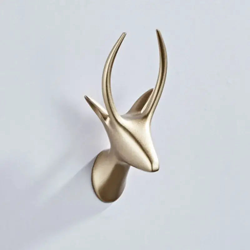 Gold-toned vintage animal brass robe hooks with sleek minimalist design and polished metallic finish for decorbites bathroom decor