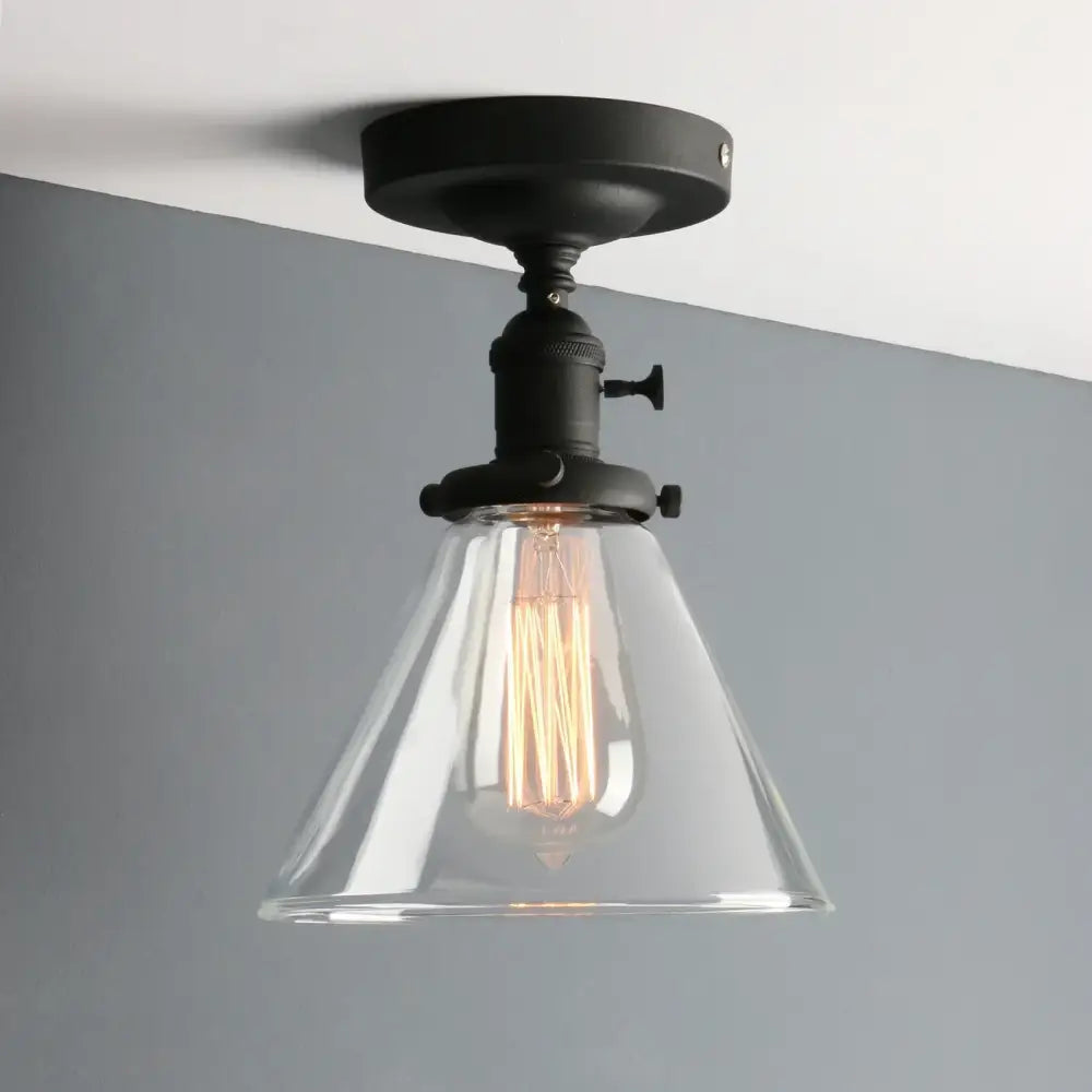 Black metal wall sconce with clear conical funnel glass shade and exposed filament bulb for decorbites funnel glass wall decorbites funnel glass wall sconce