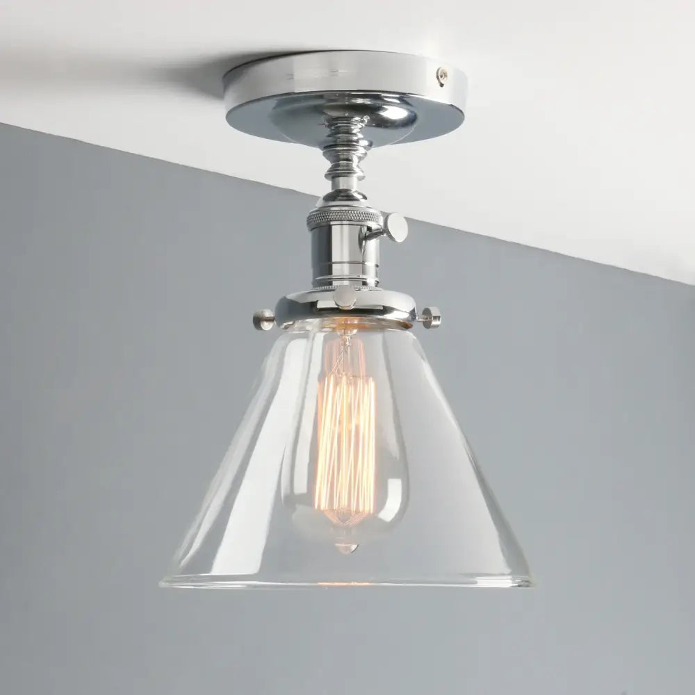Chrome-finished funnel glass wall sconce with clear conical shade and exposed filament bulb for vintage decorbites bedroom lighting