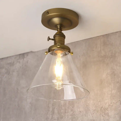 Brass-finished vintage antique decorbites funnel glass wall sconce with clear conical shade and exposed filament bulb