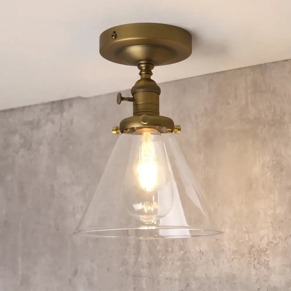 Vintage antique brass funnel glass wall sconce with clear conical shade and exposed filament bulb for bedroom decorbites funnel glass