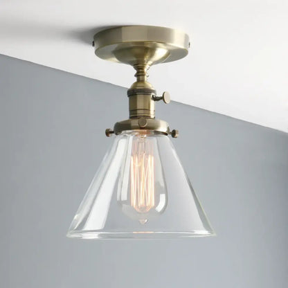 Vintage antique brass funnel glass wall sconce with clear conical shade and exposed filament bulb for bedroom decorbites funnel glass