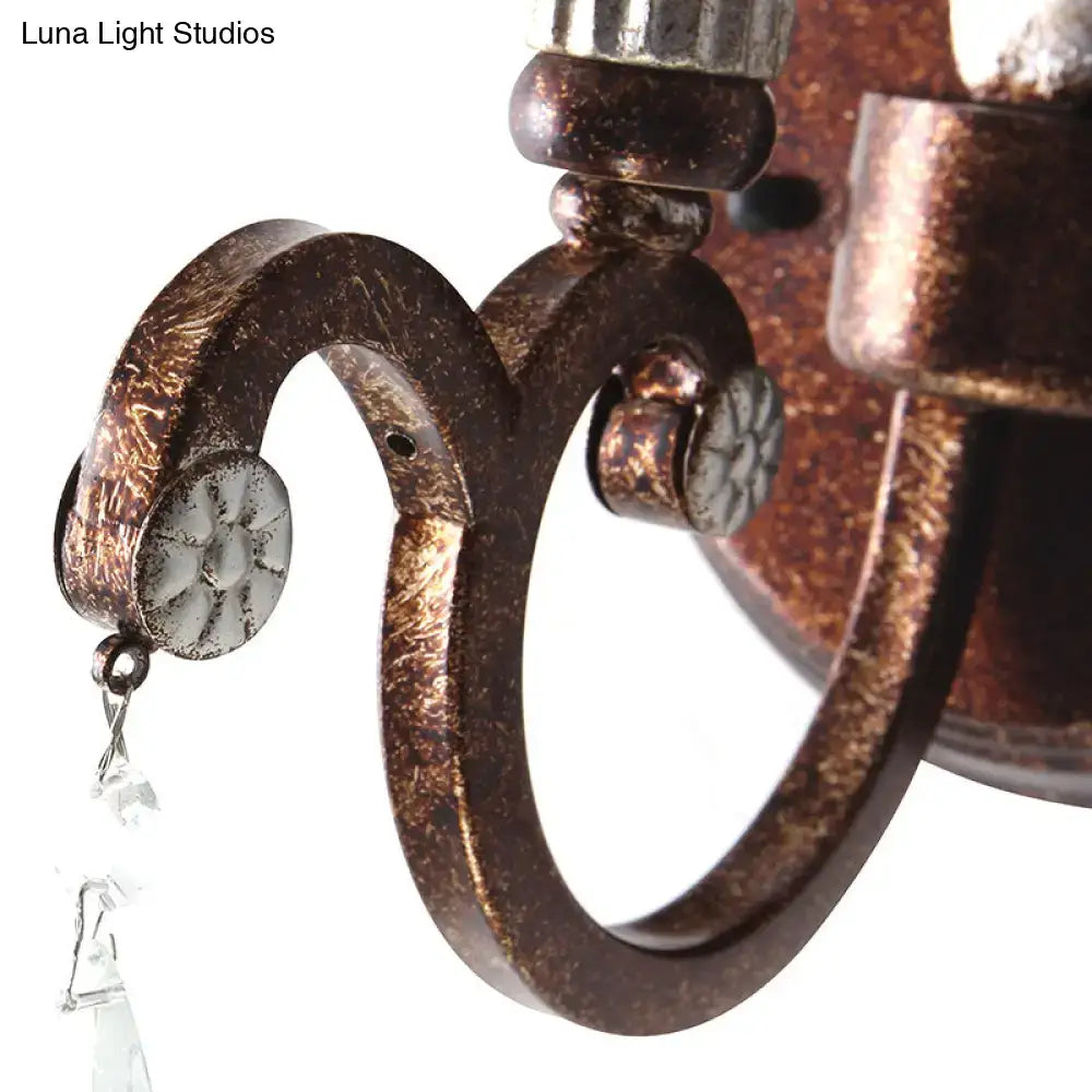 Vintage antique brass and silver leaf wall light fixture with bronze-finished wrought iron and crystal droplets sconce
