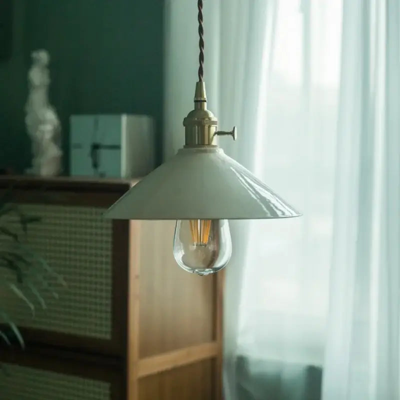 Vintage beige ceramic led pendant lamp featuring a matte white enamel shade and brass hardware for kitchen decorbites pendant lamp