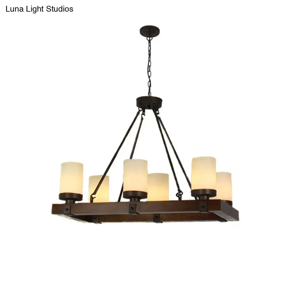 Vintage beige dining room light fixture with dark bronze farmhouse chandelier featuring six warm cylindrical glass shades