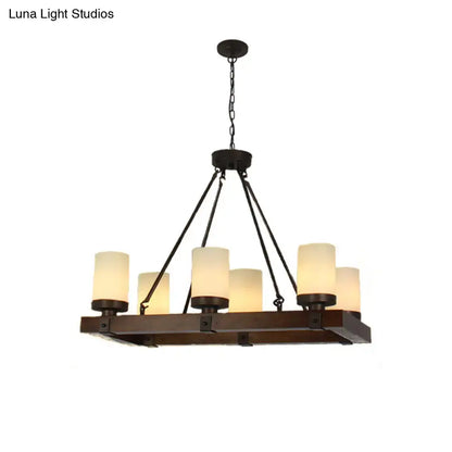 Vintage beige dining room light fixture with dark bronze farmhouse chandelier featuring six warm cylindrical glass shades