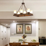 Vintage beige glass and wood light fixture dining room chandelier with six warm-toned cylindrical shades and dark metal arms