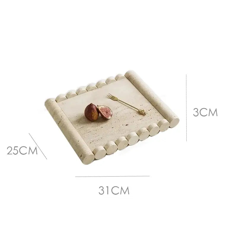 Rectangular serving tray made of beige travertine marble with rounded beaded edges and a speckled surface