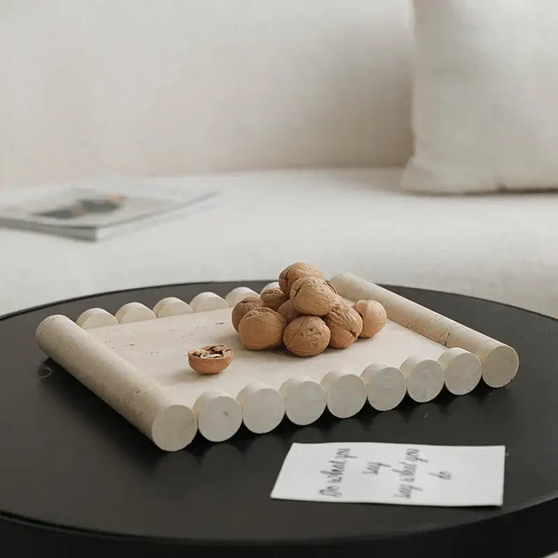 Beige travertine marble serving tray with rounded handles scalloped edge and textured surface for kitchen use
