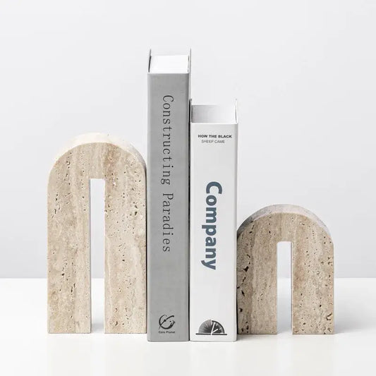 Beige travertine stone arched bookends with textured natural finish for living room decor by decorbites