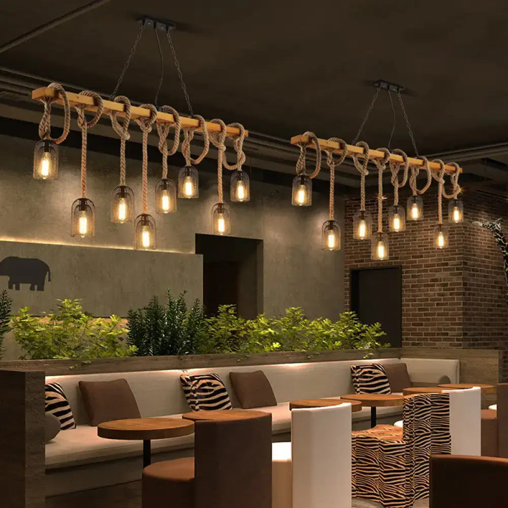 Vintage beige wooden beam chandelier featuring rustic rope knots and glass bulb fixtures ideal for kitchen island lighting