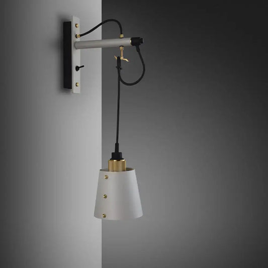 Vintage bell wall lamp with white conical shade, gold metal accents, black white finish, and adjustable wall fixture for bedroom