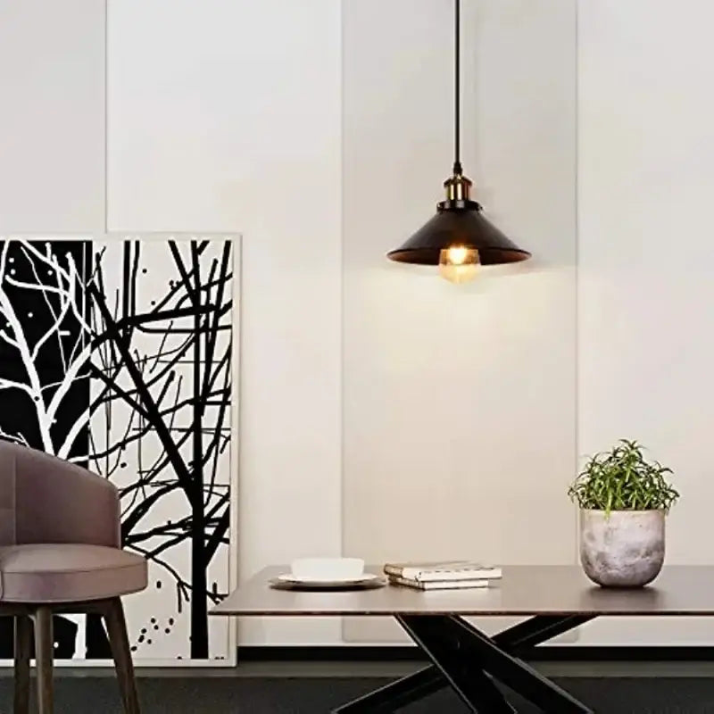 Vintage black metal pendant light with brass finish and exposed bulb for kitchen island lighting