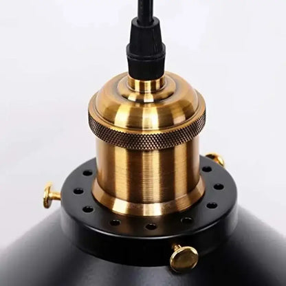 Vintage black and brass metal pendant light with black metal dome shade and textured brass finish for kitchen island lighting