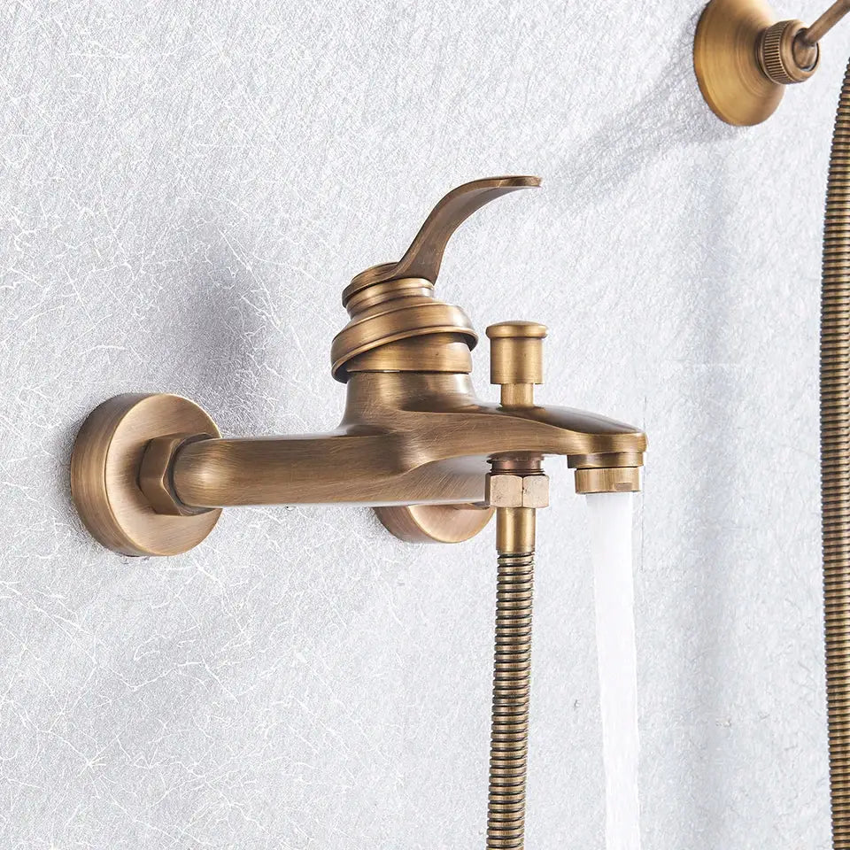 Antique brass shower faucet mixer with curved spout and integrated hand shower in vintage black brass finish