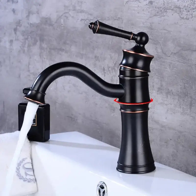 Vintage black and copper single handle high arch basin faucet with matte finish and water flowing from curved spout