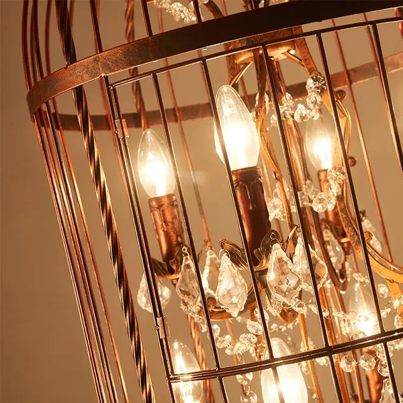 Vintage black crystal bird cage pendant light with warm-toned copper twisted bars and crystal bird cage droplets for dining decorbites