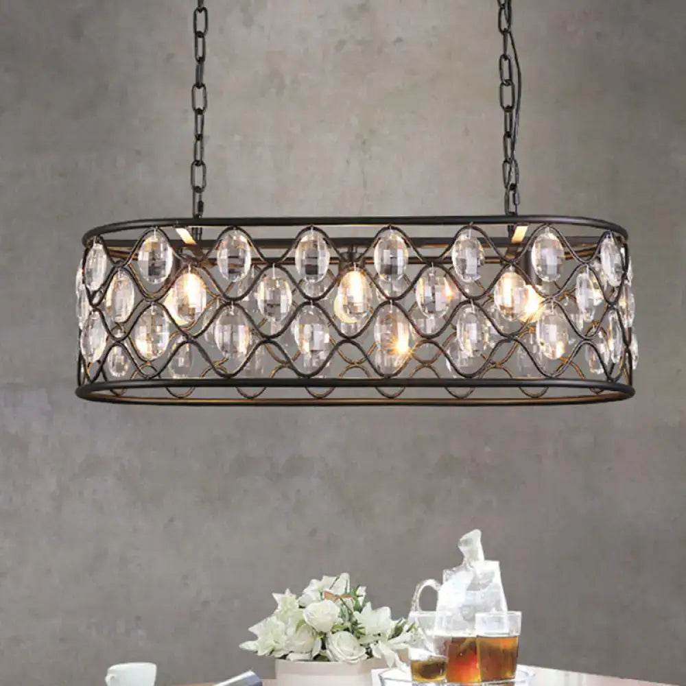 A sleek black crystal oval hanging light chandelier with wrought iron and crystal beads for dining room use