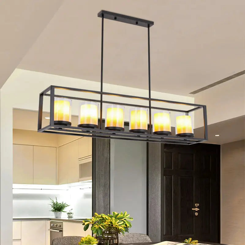 Black metal rectangular cylinder pendant light with six warm yellow candle bulbs enclosed in clear glass cylinders