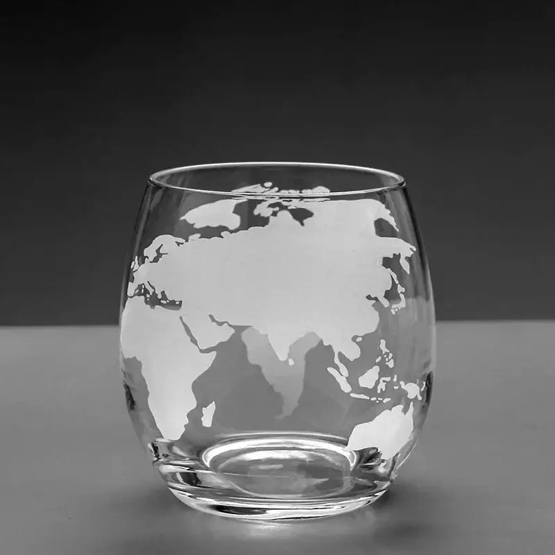 Clear glass tumbler with frosted world map etching from vintage black earth decanter set for elegant dining room use