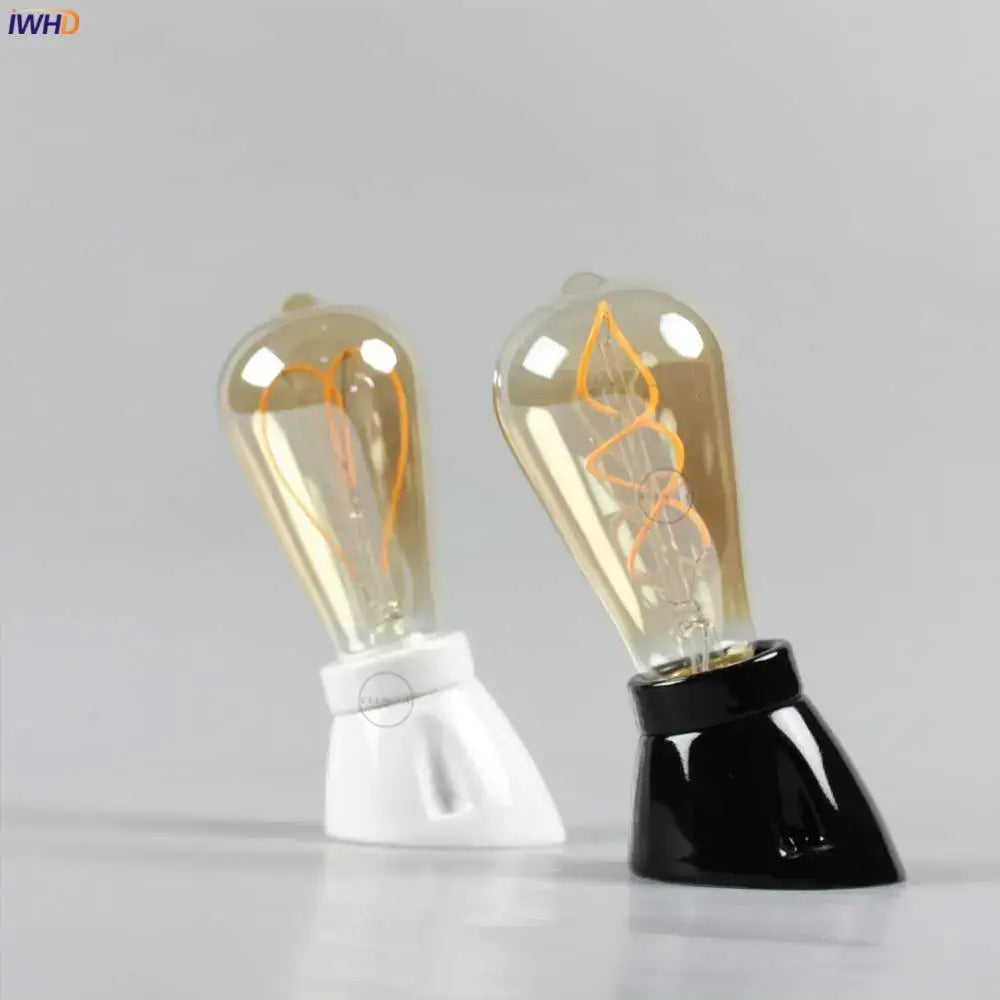 Two vintage-style edison filament light bulbs in white and black glossy ceramic lamp holder socket fitting for bedroom table light