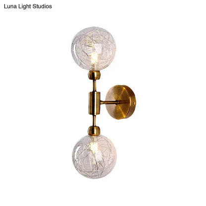Brass-finished vintage wall sconce with two clear crackled glass globe shades for e26 e27 bulbs in bedroom use