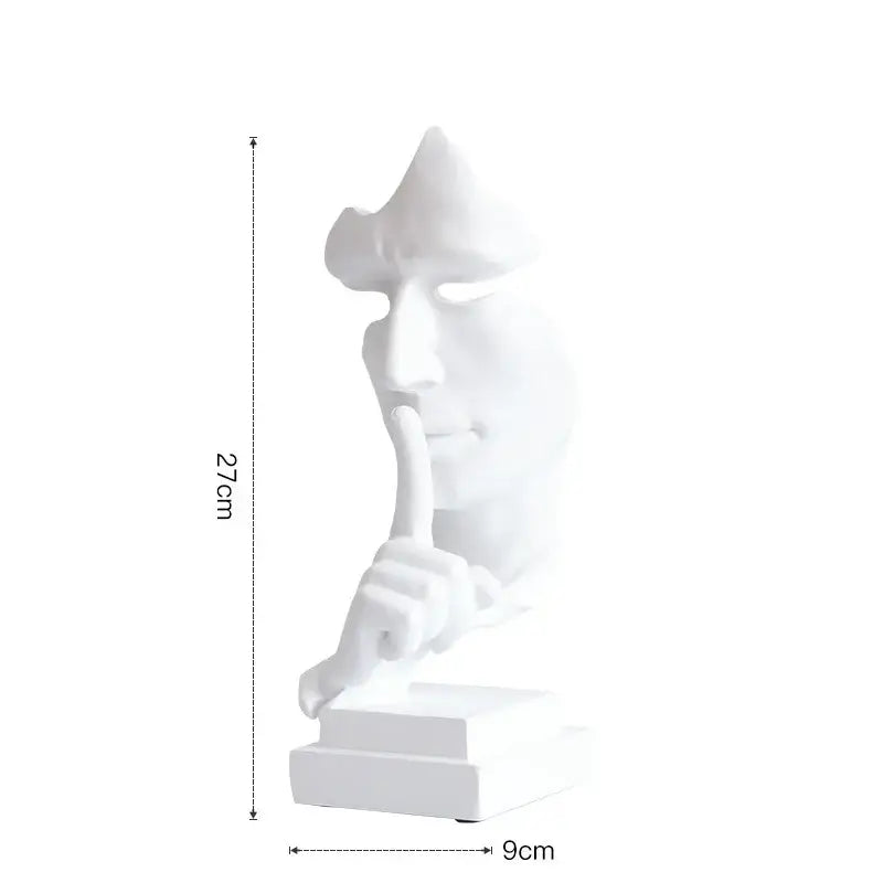 White ceramic 27cm silence golden face sculpture with hand shh gesture on matching base for office decor
