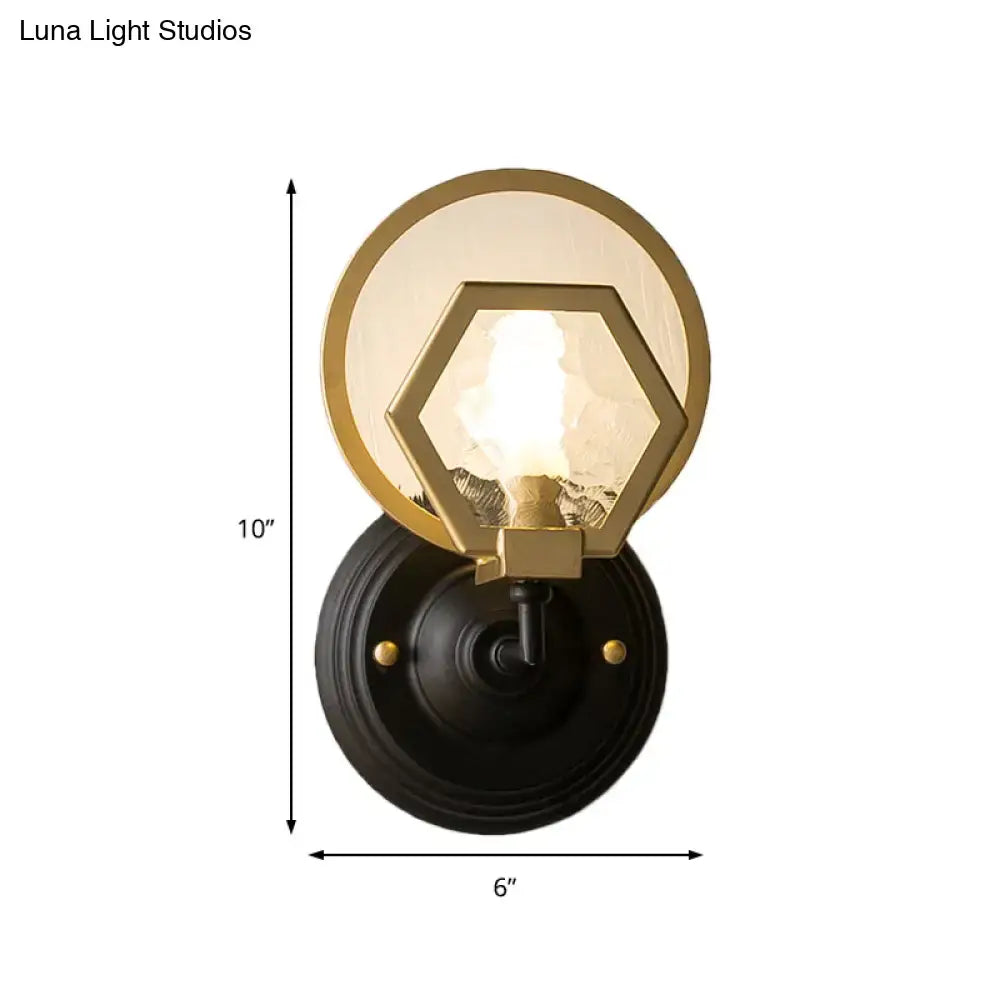 Vintage black and gold geometric wall lamp with black finish and amber glass shade for stylish living space lighting