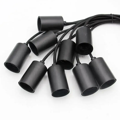 Set of black matte-finished cylindrical pendant lights with integrated cords in vintage black industrial pendant chandelier design