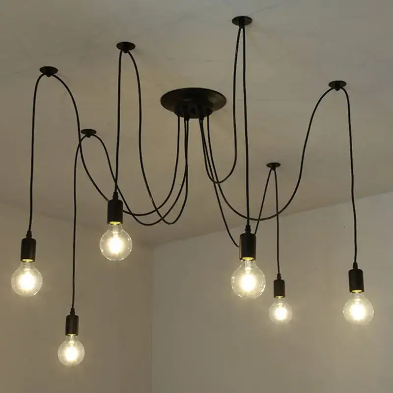 Vintage black industrial pendant chandelier with multiple exposed filament bulbs and curved cords for dining room pendant light