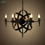 Vintage black iron pendant light featuring an atomic model design with five lit candle-style bulbs for decorbites iron pendant