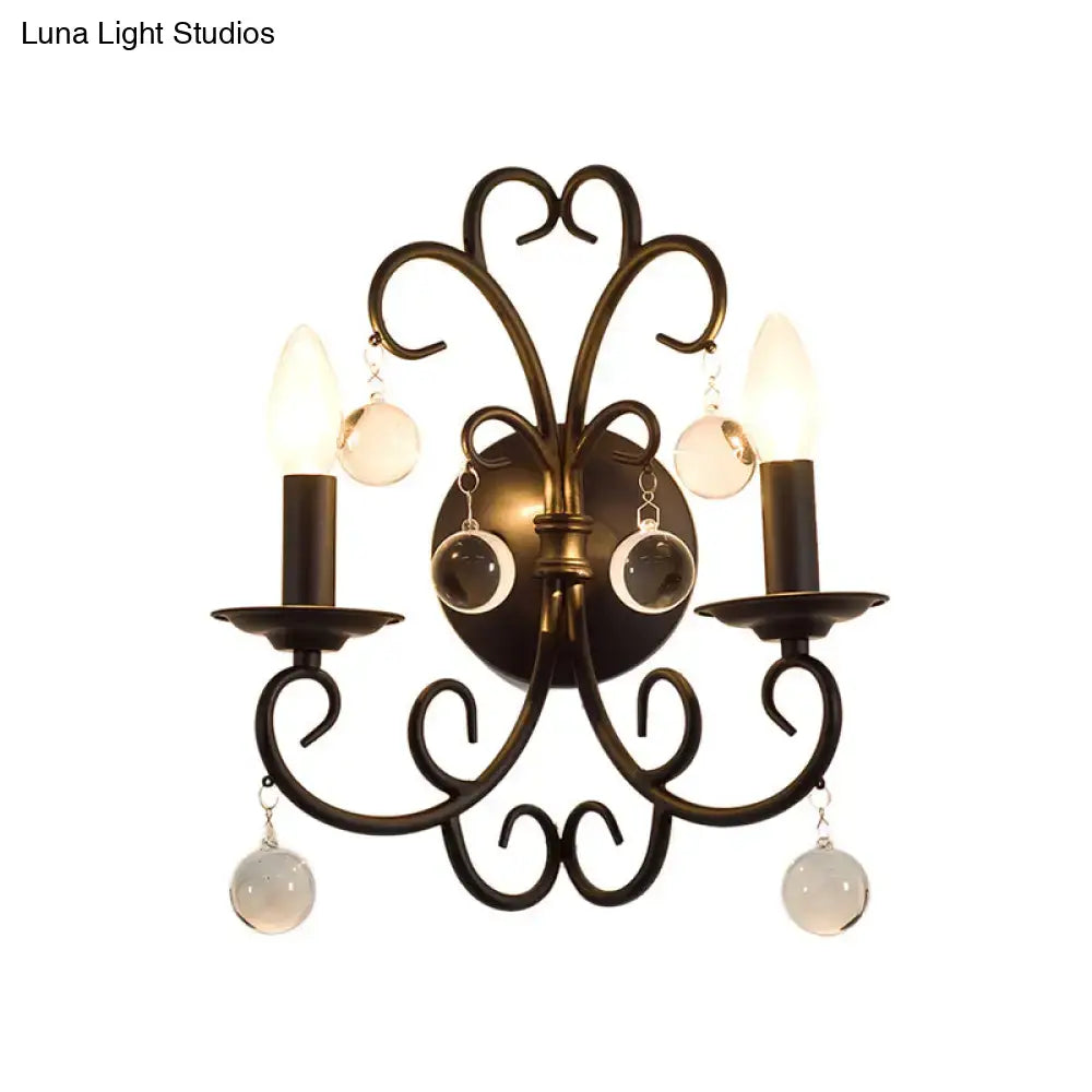Antique bronze wrought iron wall light with two candle bulbs and crystal ball deco frosted glass orbs for living room
