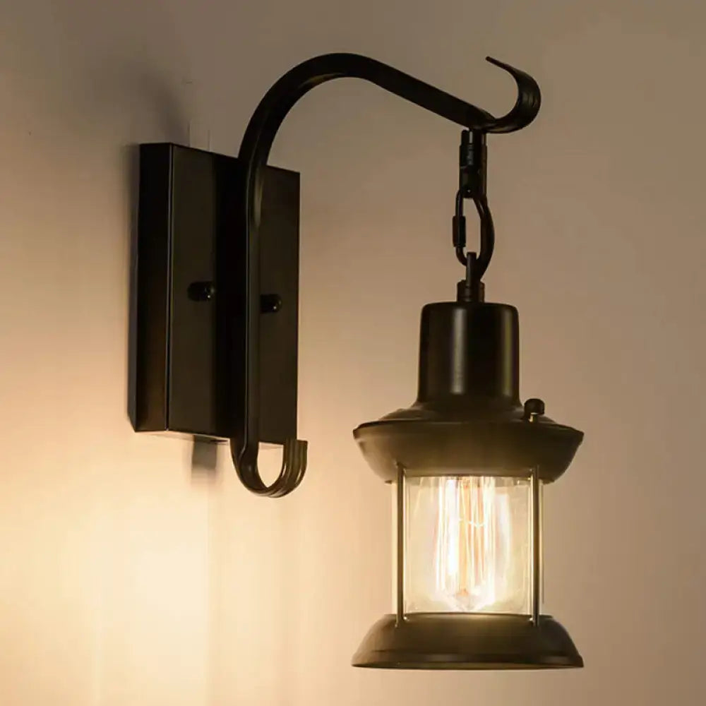 Black wrought iron DecorBites coastal glass lantern wall sconce light fixture with curved arm for dining room lighting