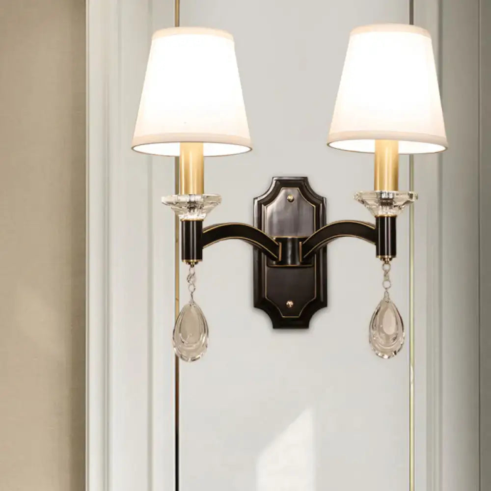 Vintage black metal wall lamp with cut crystal teardrop pendants and cream lampshades for bedroom lighting