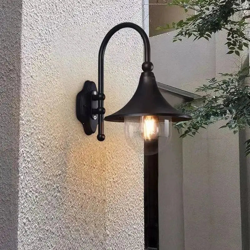 Black wrought iron vintage wall lamp with clear glass shade and exposed bulb for outdoor decorbites black outdoor wall use