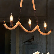 DecorBites™ vintage black rope pendant light with three lit candle-style bulbs for dining room island lighting