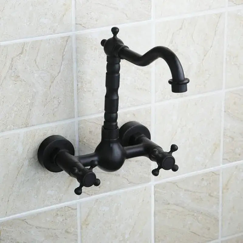 Vintage black swivel wall mounted bathroom faucet with ceramic base and black matte finish featuring curved spout and cross handles