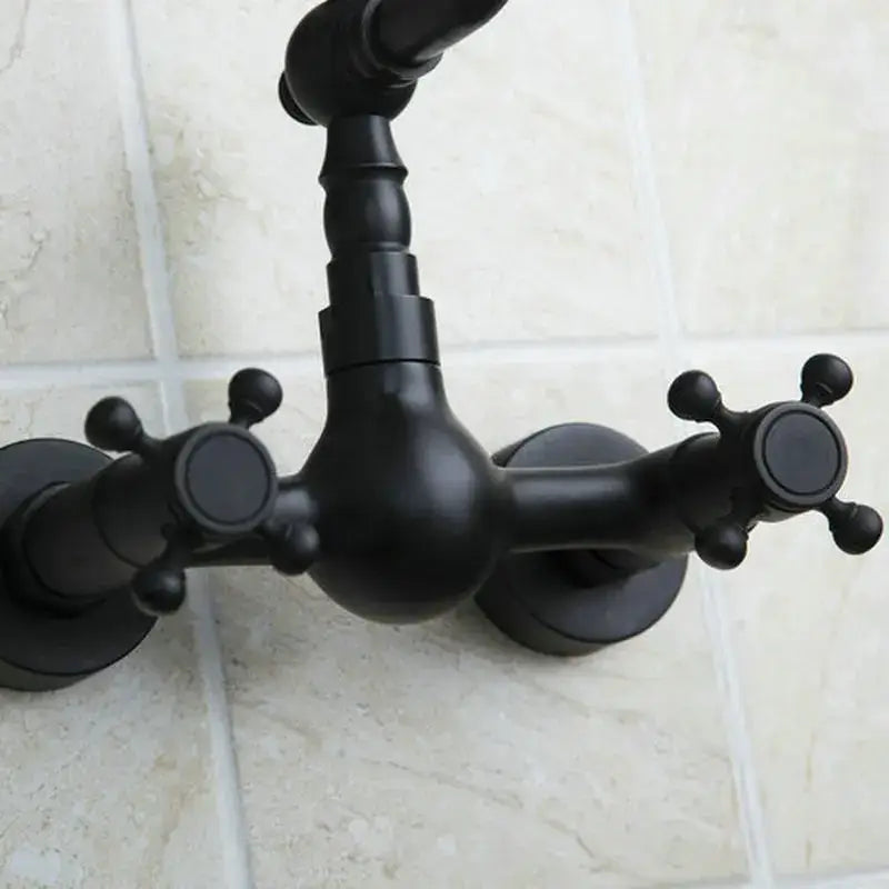 Vintage black swivel wall mounted bathroom faucet with black matte finish, ceramic base, and two cross handles decorbites black swivel