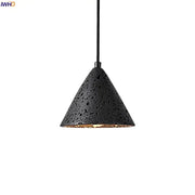 Vintage black travertine led pendant light with textured perforated exterior and warm gold interior for living room decorbites black travertine